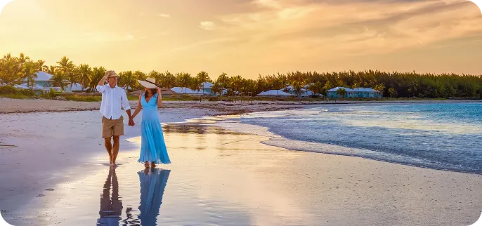 Couple walking on the beach on vacation - cash out refinance