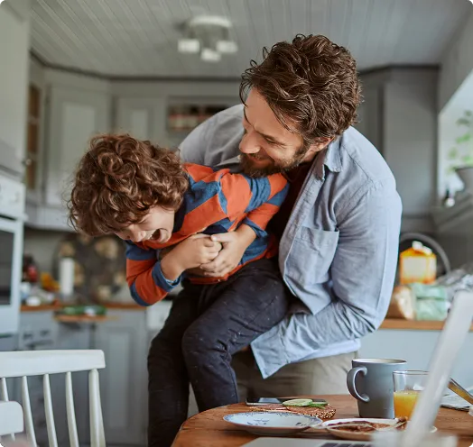 Father holding and hugging child
