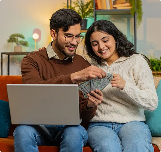Couple counting money in front of a computer - cash out refinance