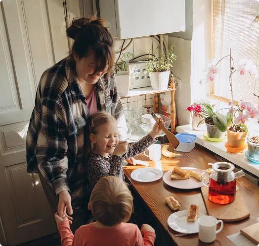 Mother and children eating breakfast - FHA Loan