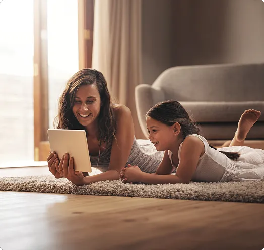 Mother and daughter sitting on the floor
