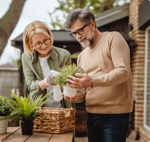 Couple gardening outside - Home Equity