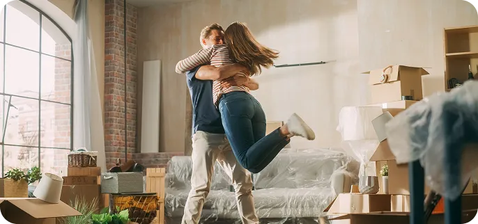 happy couple hugging - conventional loan purchase loan
