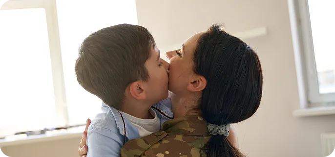 Veteran holding child