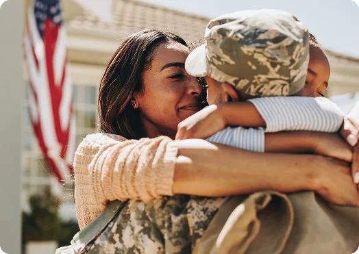 Veteran and partner hugging closely - VA Loan