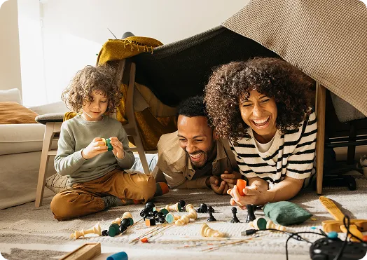 Dad with children playing games on the ground