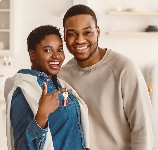 Man and woman smiling standing side by side